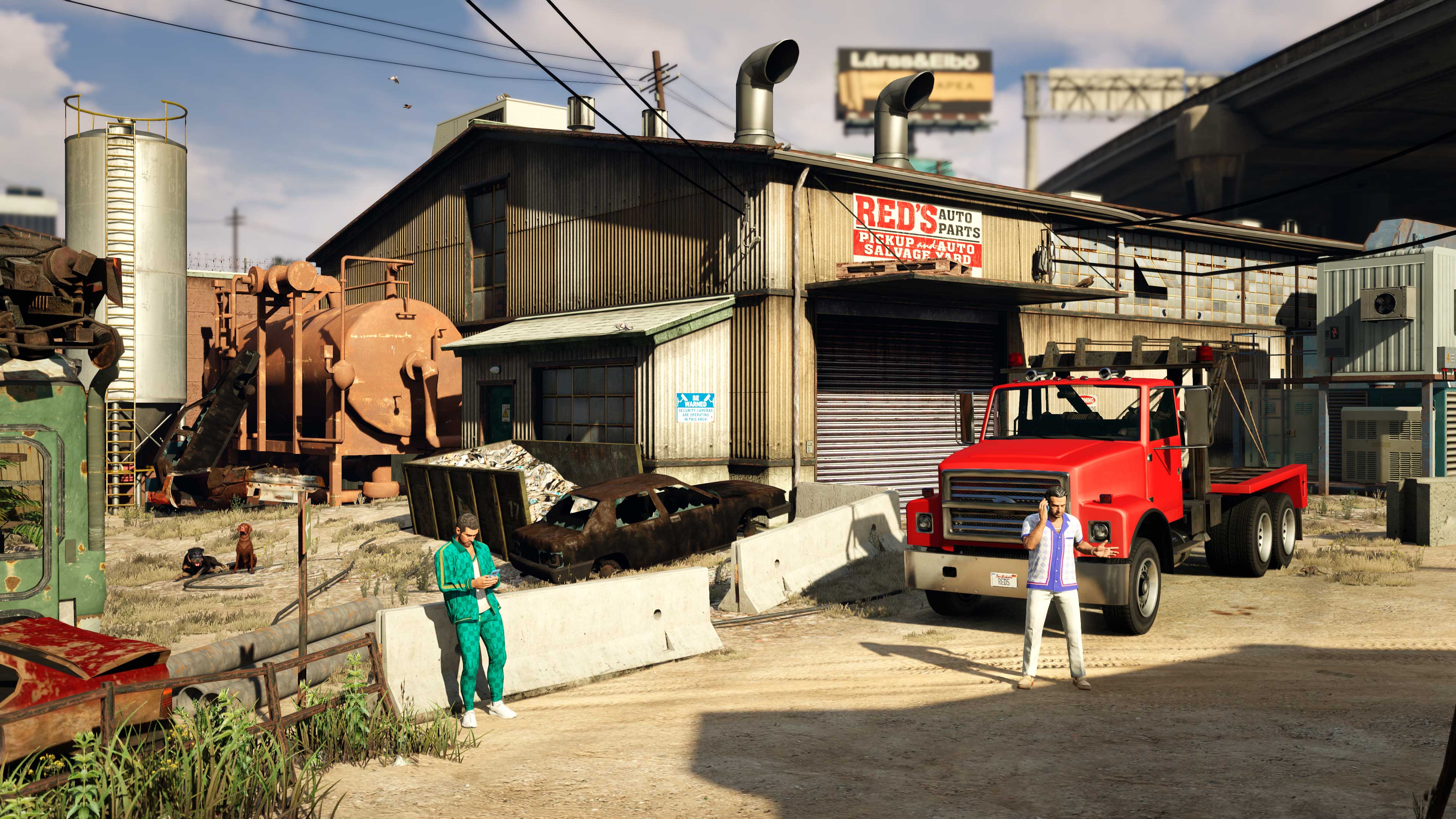 At Red’s Auto Parts Salvage Yard, Yusuf and Jamal Amir are busy on their phones.  