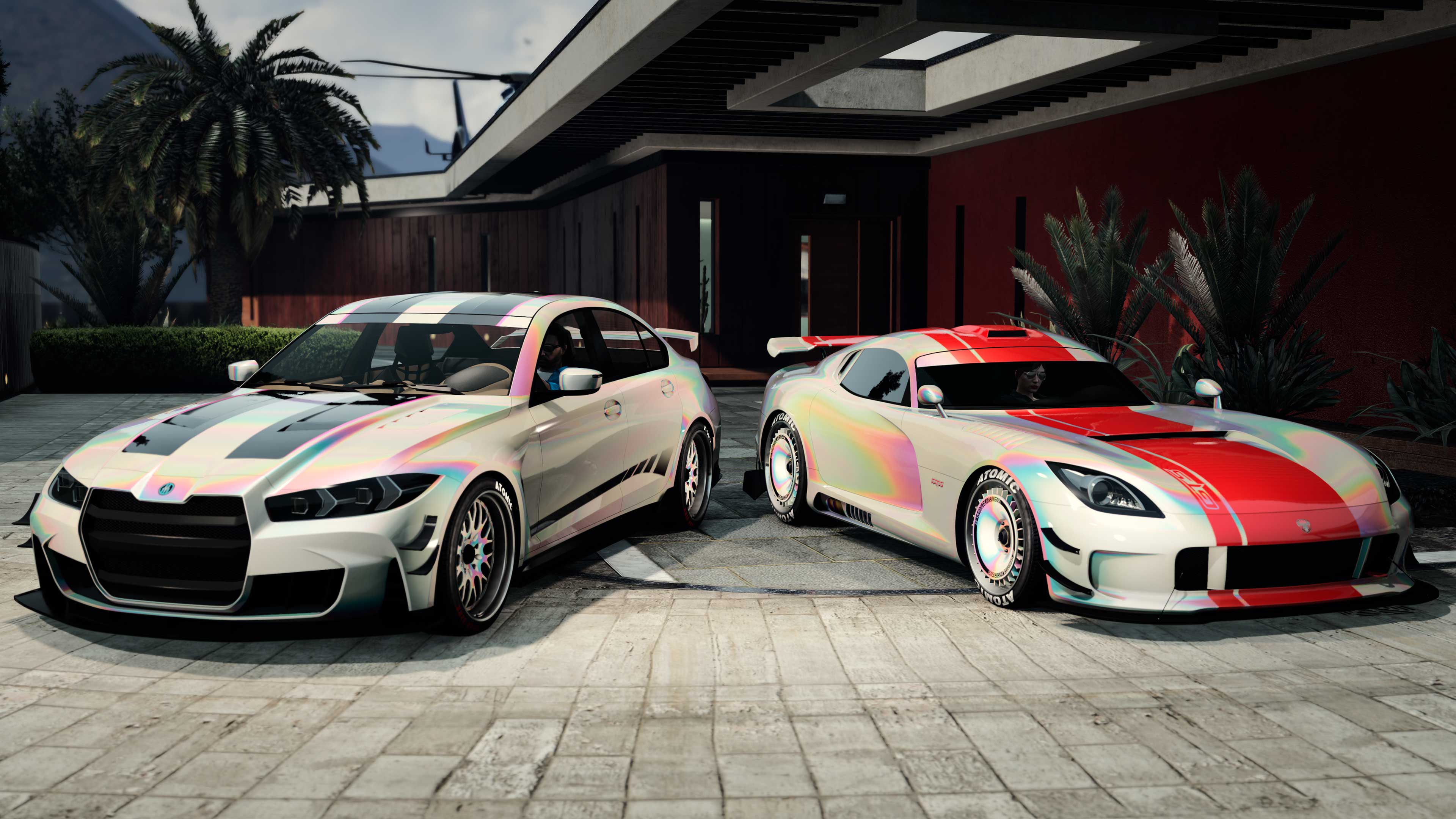 Two cars with the Cream Pearl Chameleon Paint and Wheel Paint outside a luxury property. 