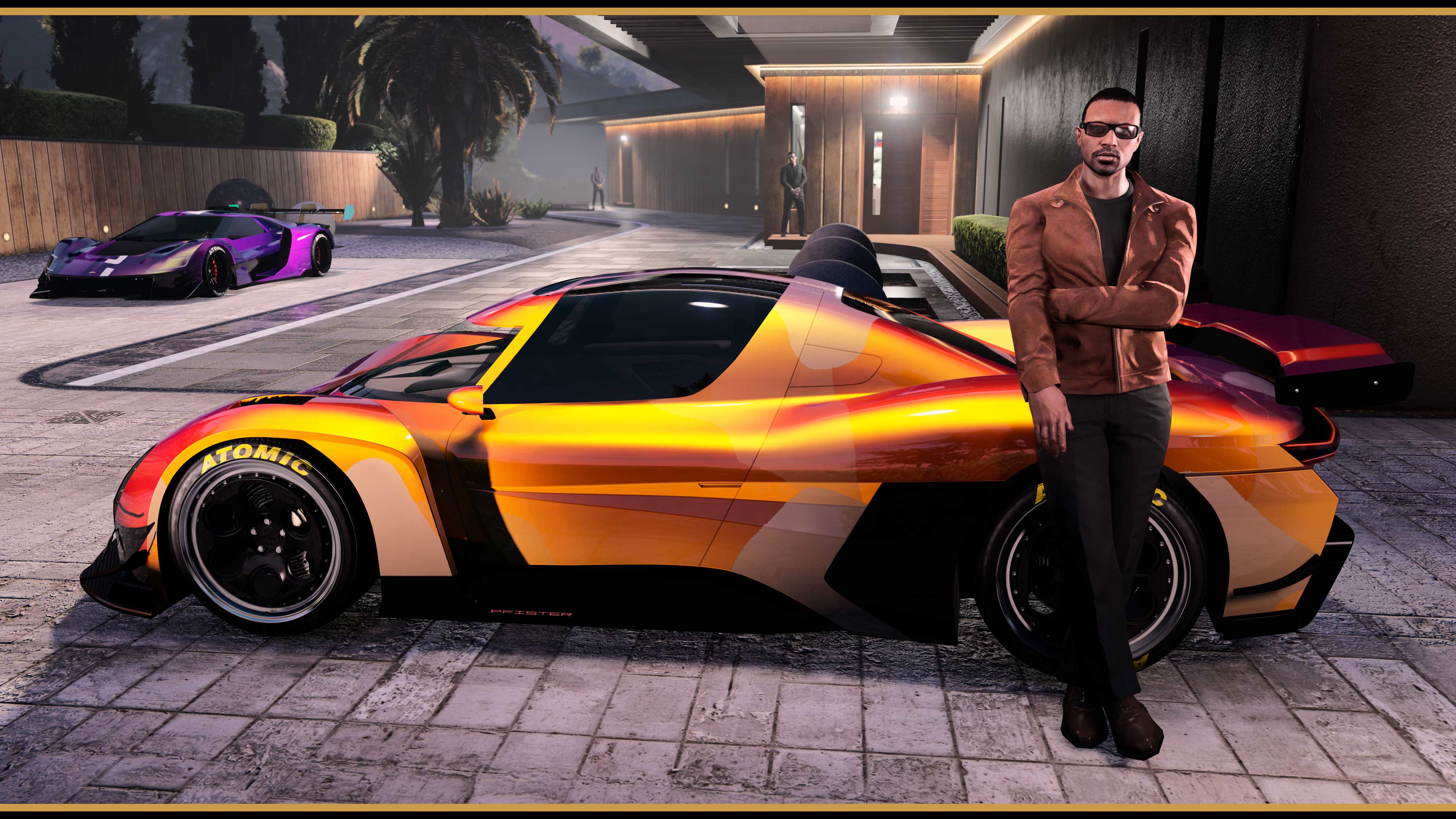 A GTA Online character leans against a modified orange exotic vehicle. A modified purple vehicle is parked in the background on the driveway. 