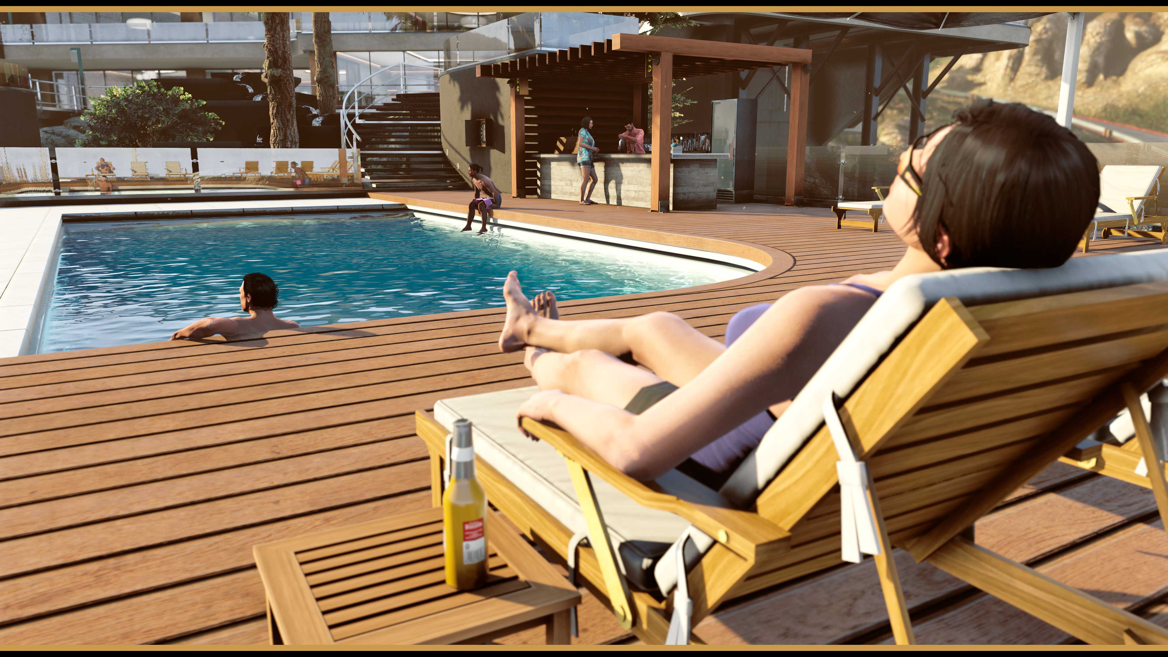GTA Online characters lounge at the large swimming pool. 
