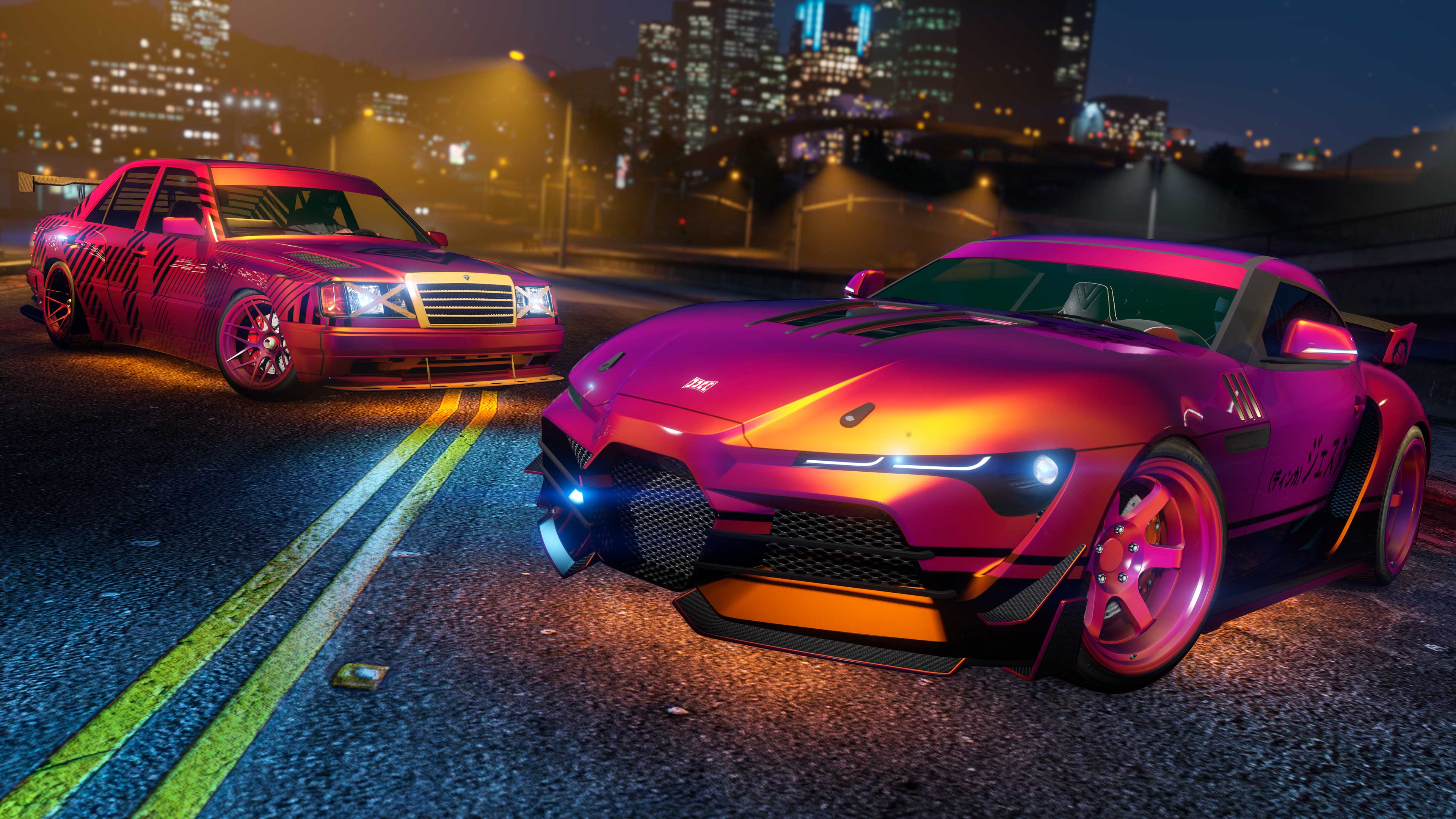 Two cars on a night road with the Magenta/Orange Flip Chameleon Paint and Wheel Paint.