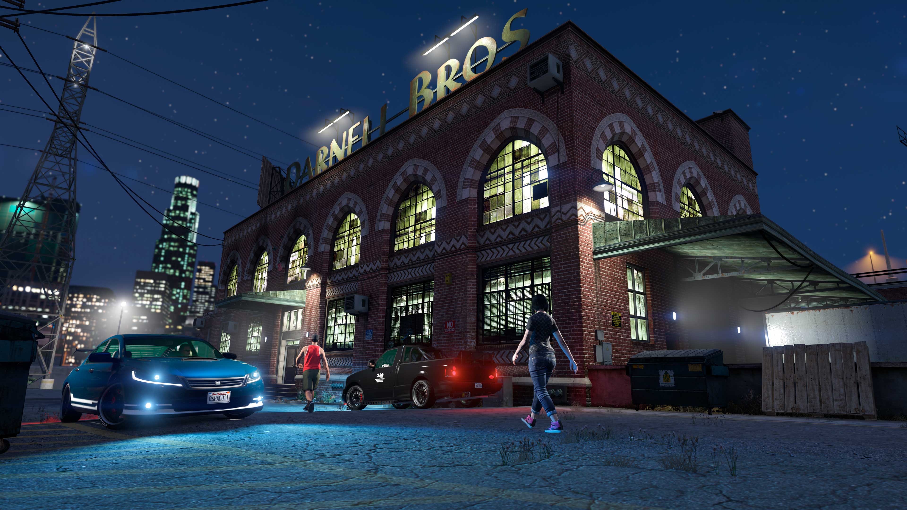 The Garment Factory building with the rooftop “Darnell Bros” sign lit up. 