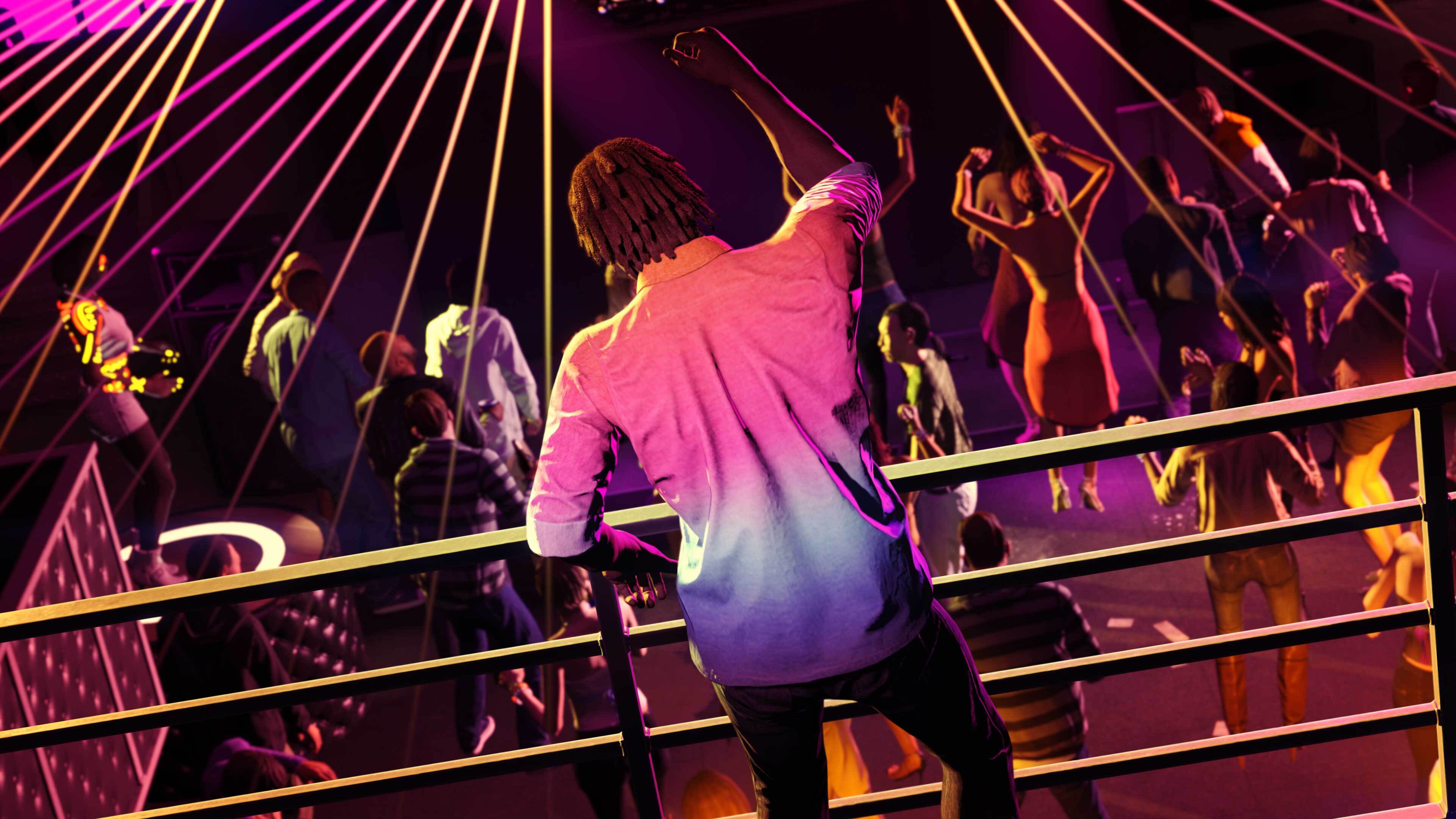 People dancing inside of a nightclub.