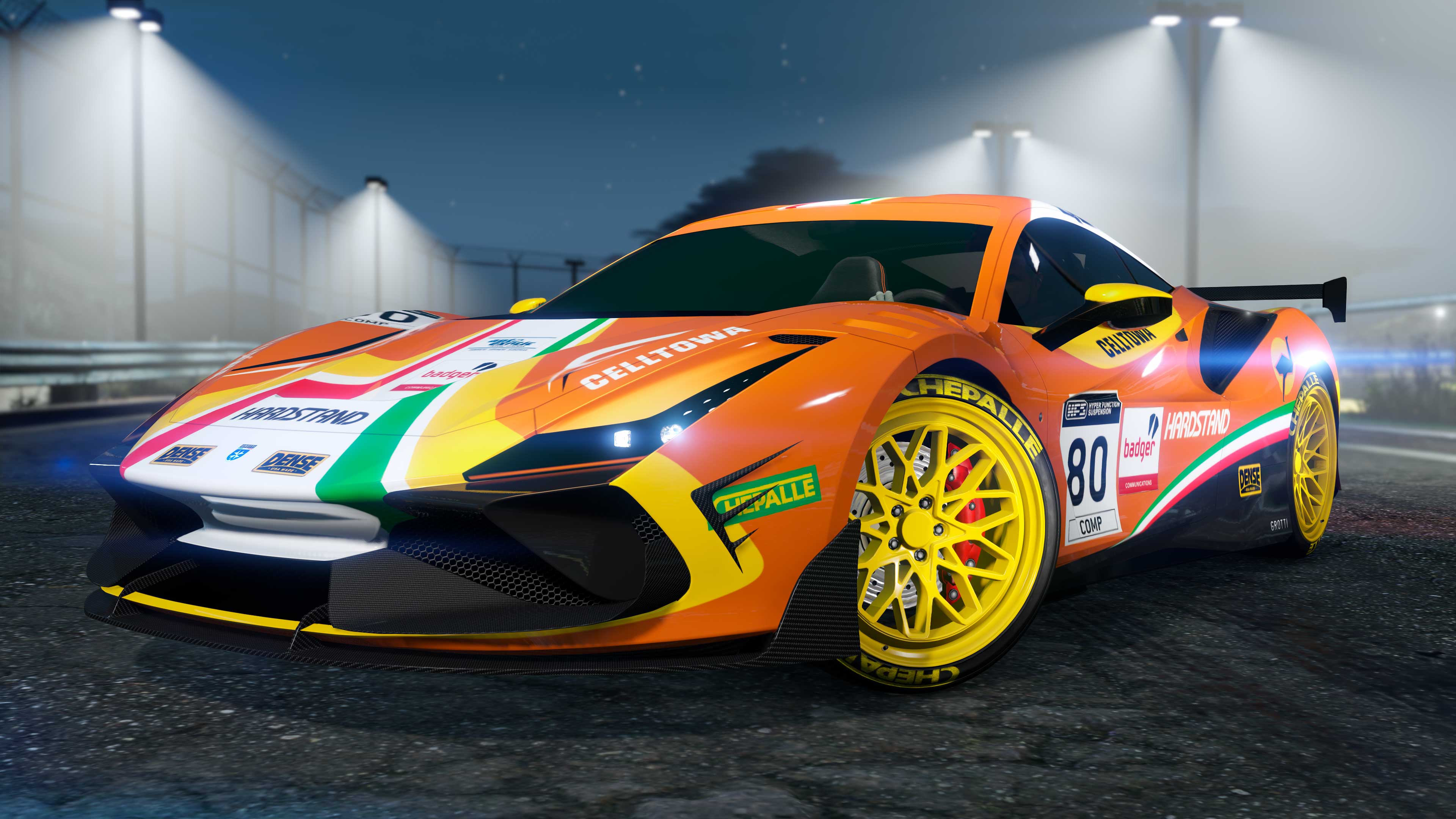 An orange three-door Grotti Turismo Omaggio with a racing decal livery. 