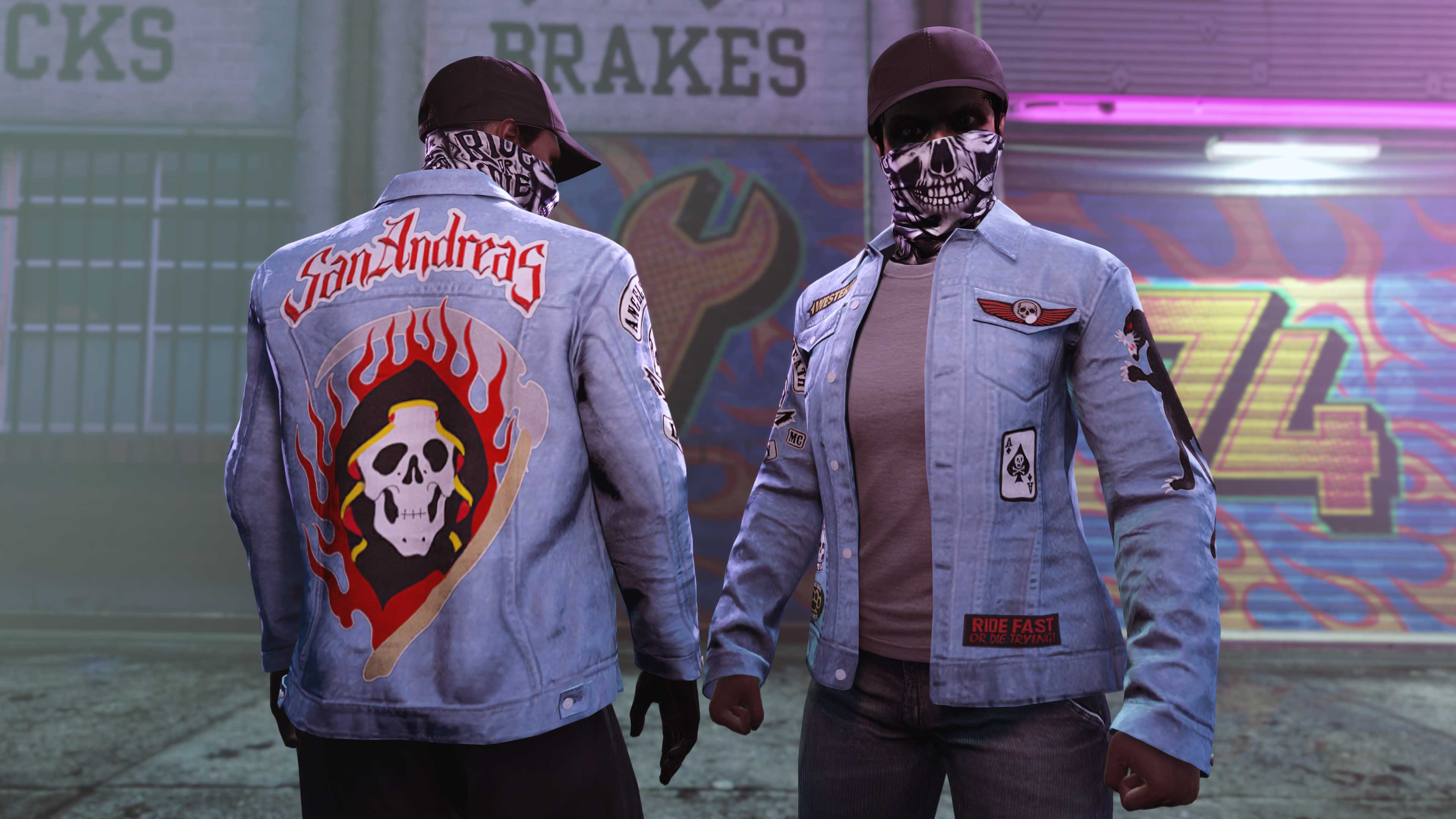 Two characters wear the Ride or Die Gaiter and SA Denim Biker Jacket with a hooded skeleton in front of flames on the back. 