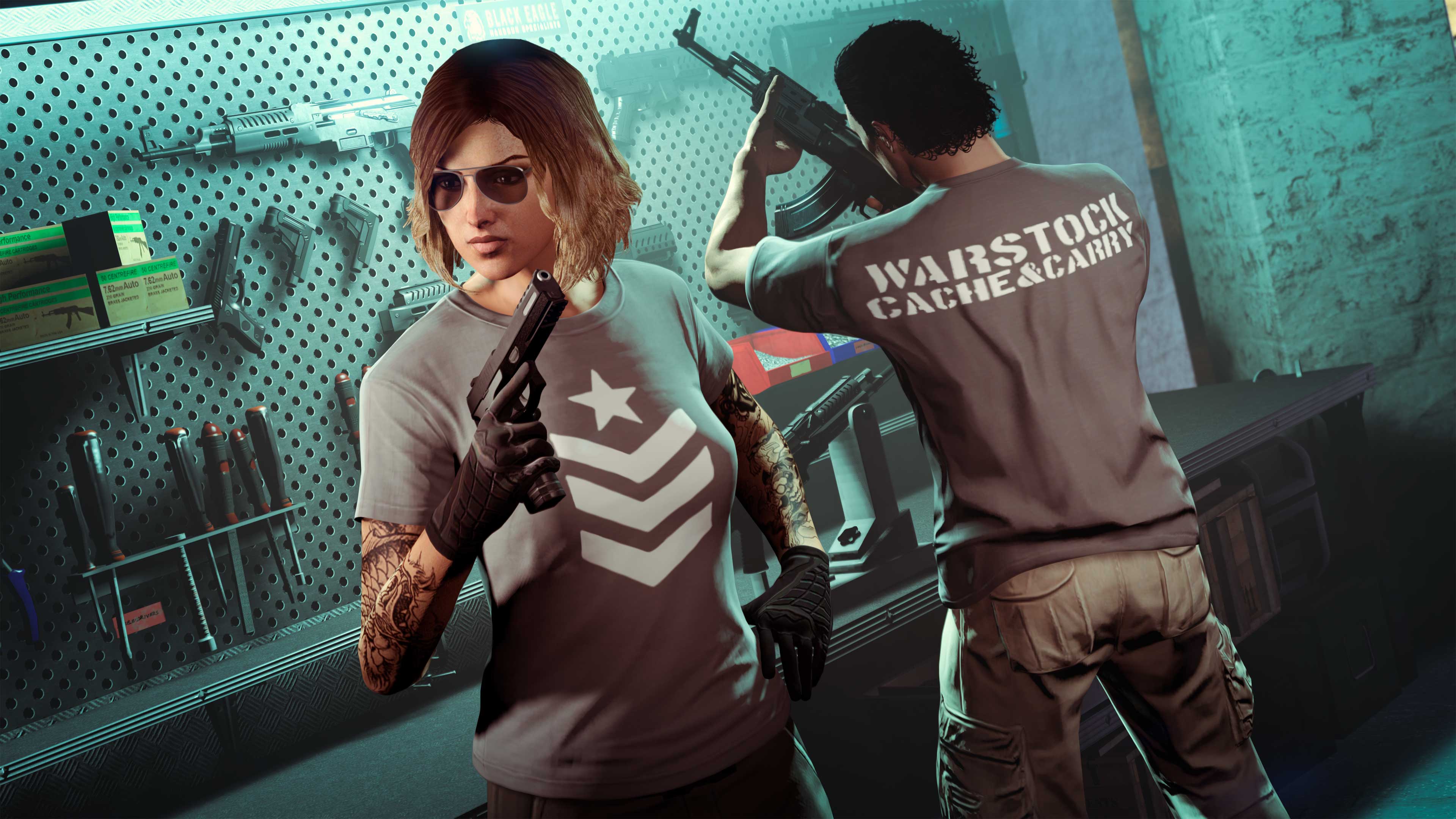 Two GTA Online characters prepare weapons in a bunker while wearing grey Warstock tees featuring the brand on the front, and text reading “Warstock Cache and Carry” on the reverse.
