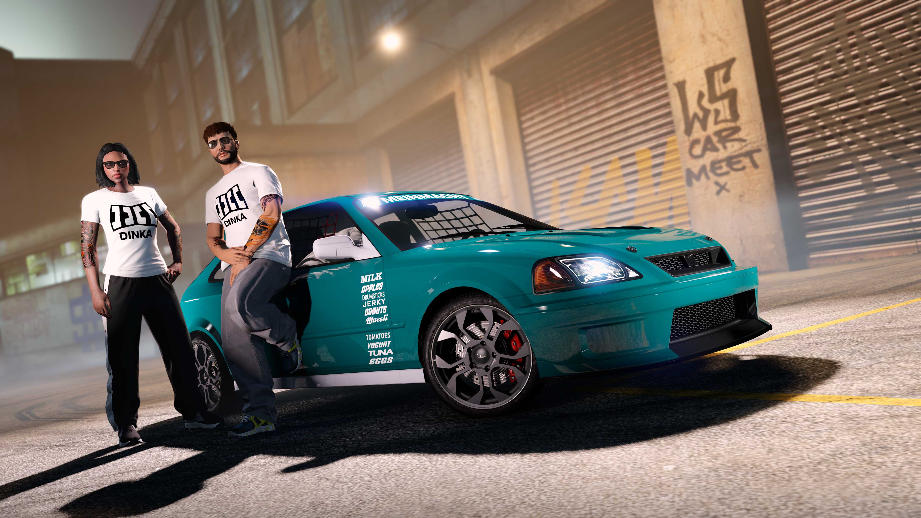 Two GTA Online characters wear the white Dinka Tee with black logo. They pose next to a three-door teal Dinka Blista Kanjo.