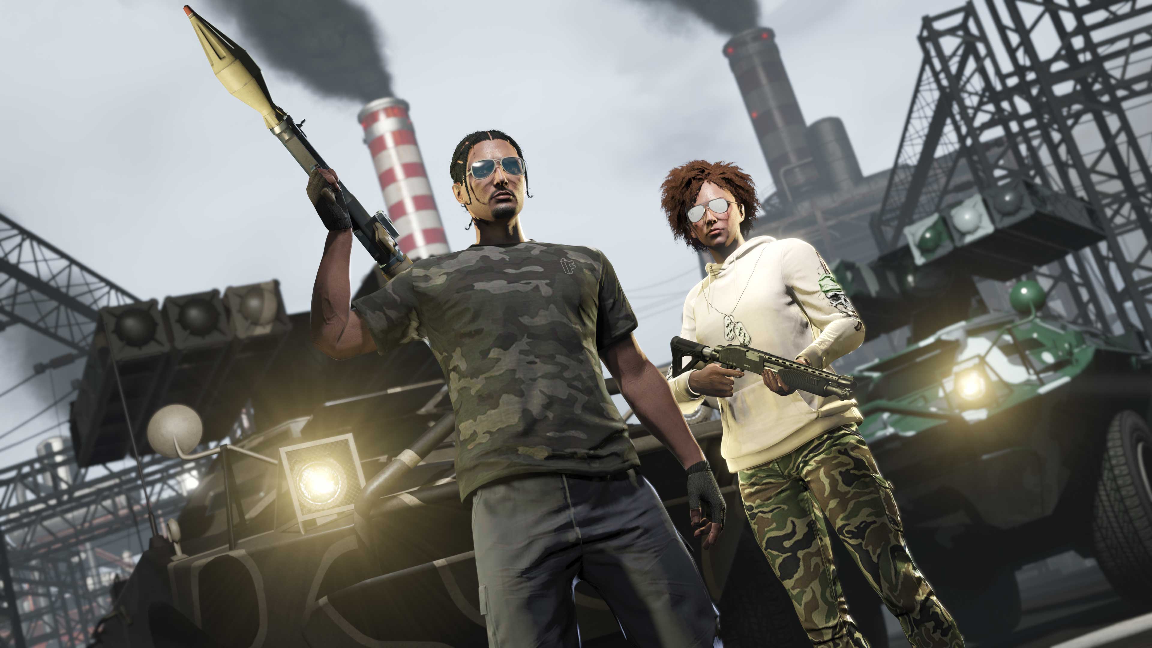 Two GTA Online players pose with weapons. One holds a rocket launcher while wearing the Vom Feuer Camo Tee.