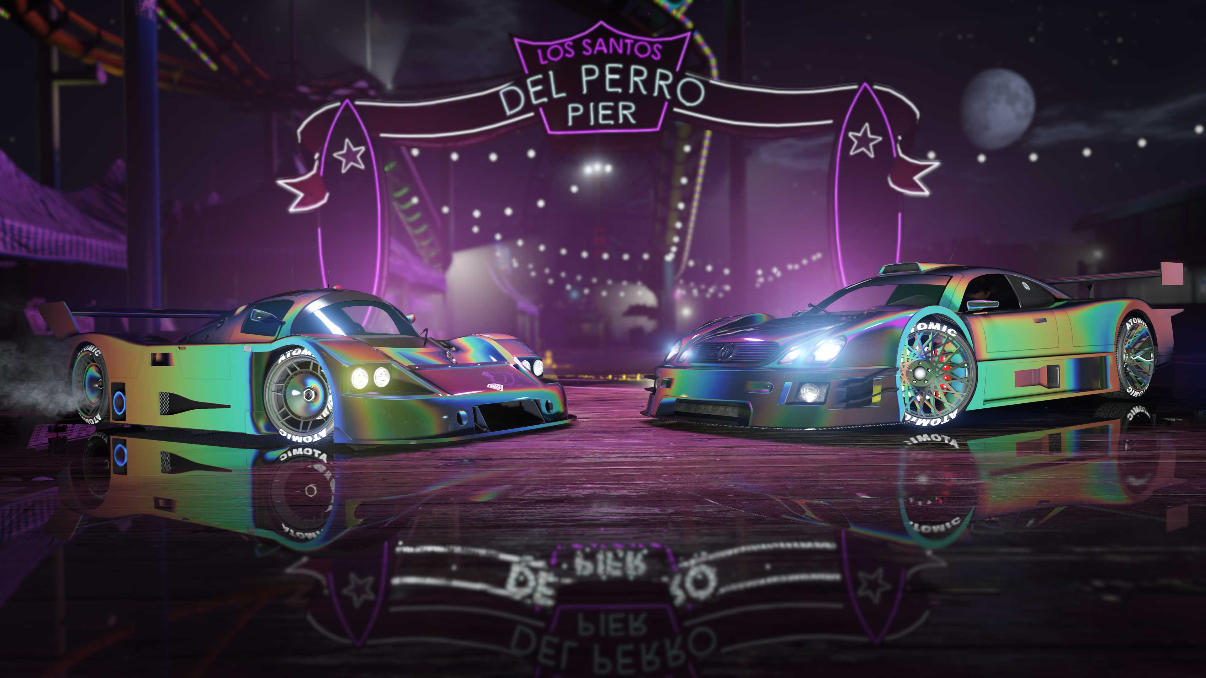 Two cars with the Black Oil Spill Prismatic Chameleon Paint and Wheel Paint under the neon sign for the Los Santos Del Perro Pier. 