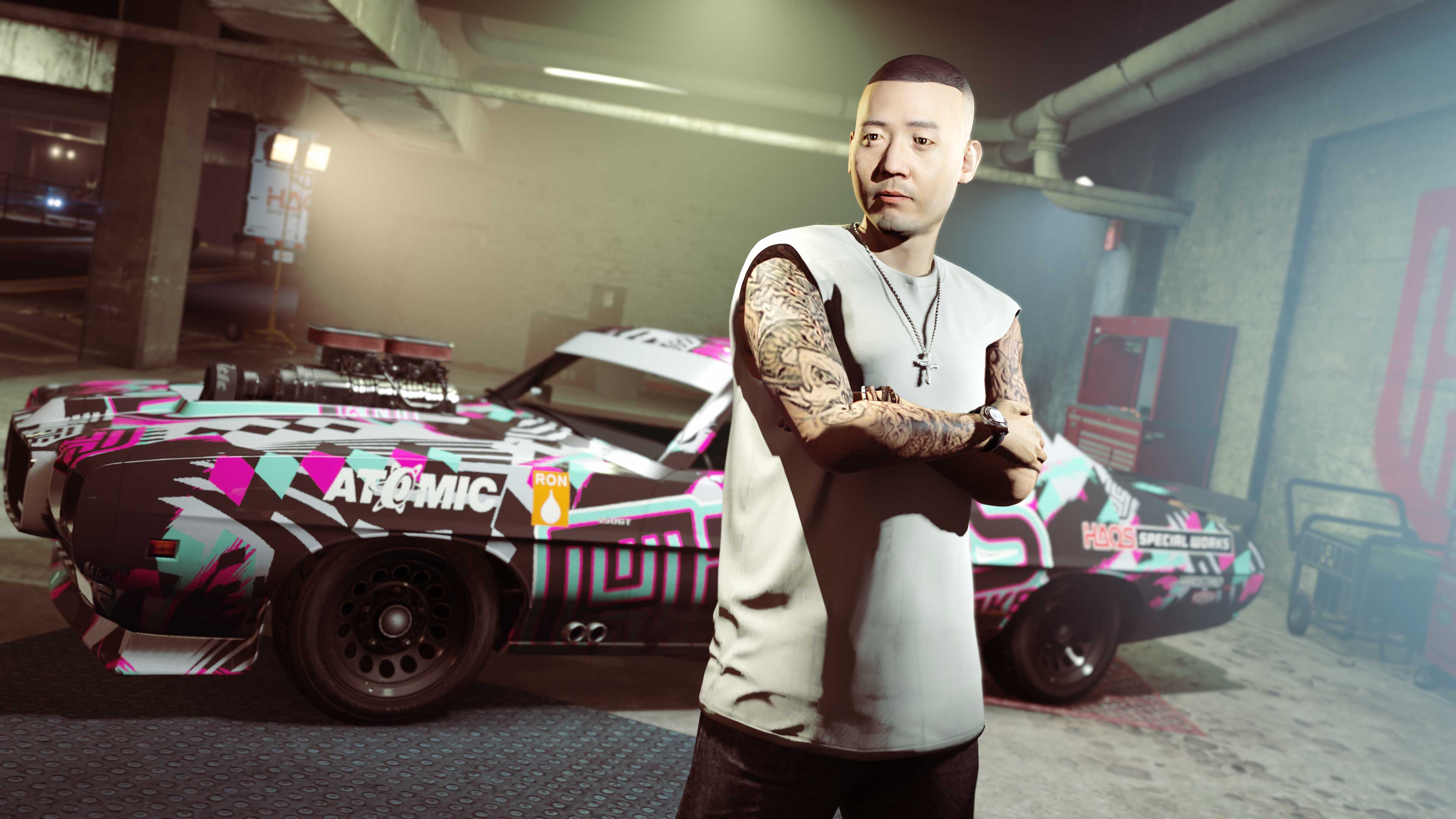 Hao stands near a modified car. 