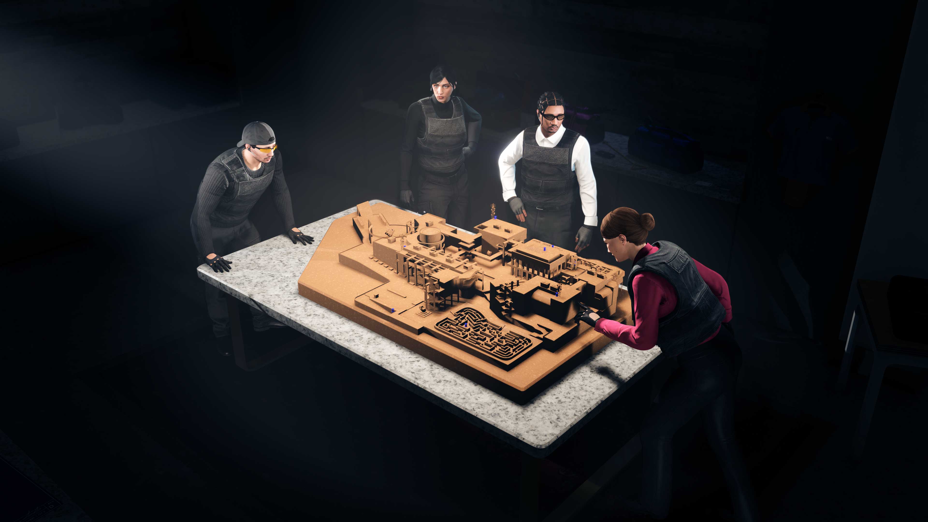 GTA Online characters gather around a table with a large model of the Kortz Center. 
